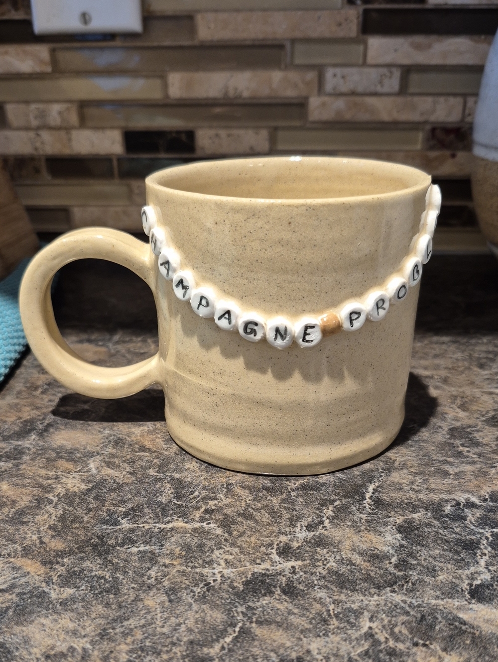 Handmade Pottery  Mug with Bead Letters 'Champagne Problems'